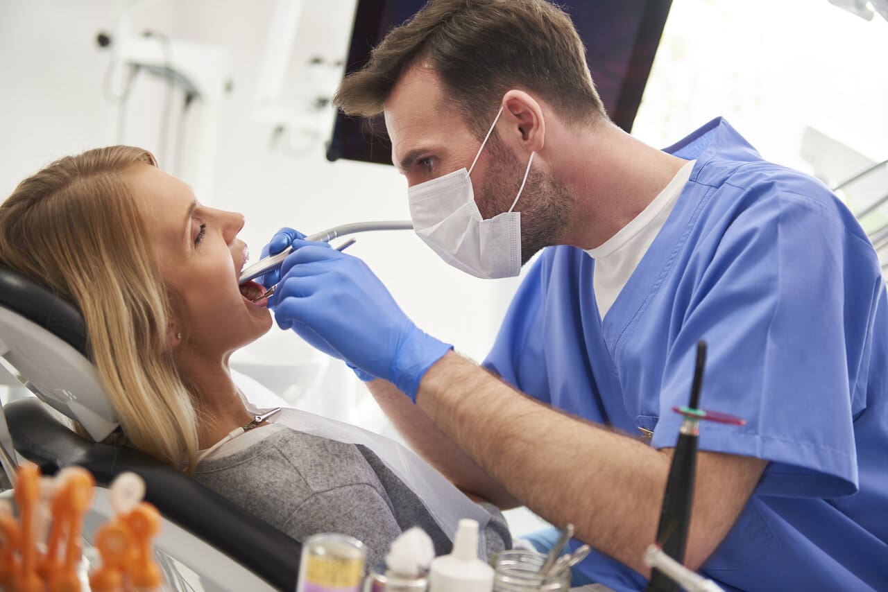 dentist giving a dental treatment