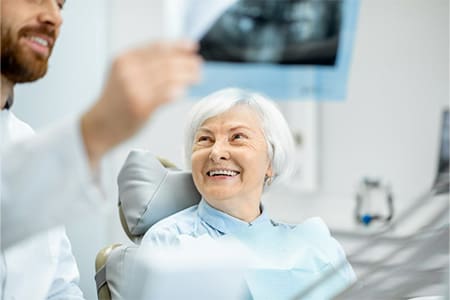 Dentist reviewing a patient’s X-ray