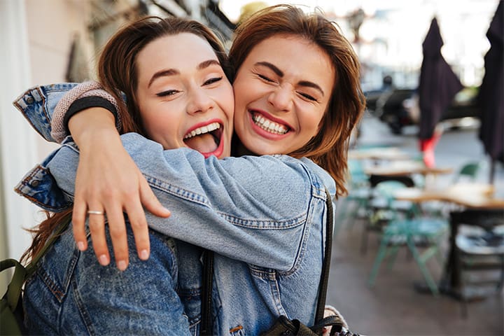 Patient in Weston smiling with friend after smile makeover