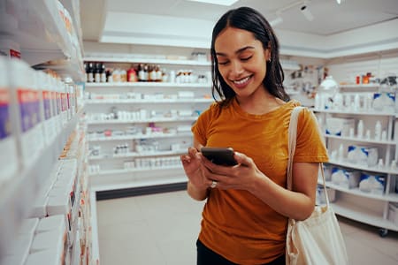 Patient in pharmacy looking for whitening treatments.